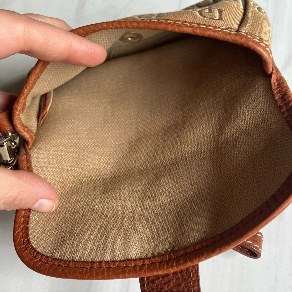 Dooney and Bourke signature logo tan leather and‎ brown monogram fabric wristlet